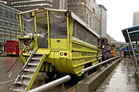 A colorful row of Boston Duck Tours' Amphibious Vehicles are parked in the rain at the "Duck Stop" in front of the Prudential Center in Boston.