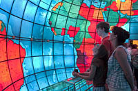 A family visits the five-story stained-glass globe at the Mapparium at the Mary Baker Eddy Library for the Betterment of Humanity