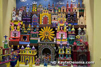 A colorful exhibit of churches at the Casa de Arte Popular in Cancun, Mexico.