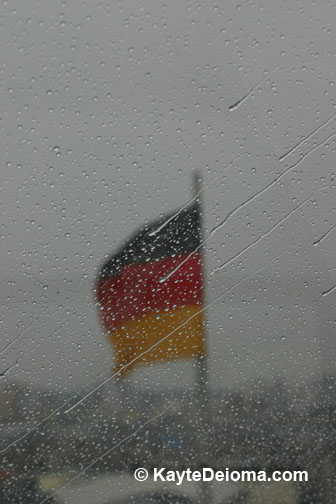 The German flag seen through the rain-spattered Reichstag Dome.