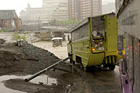 Amphibious vehicles drive into the Charles River on a rainy day Duck Tour in Boston, MA