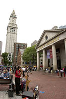 A musician plays in front of Quincy Market, Faneuil Hall Marketplace, Boston, MA