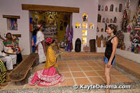 A visitor admires the life-size figures in the chapel created at the Mexican Folk Art Museum.