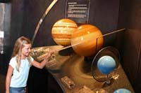 Becca examines the rings of Saturn