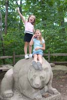 Sarah and Becca pose on top of "Old Grizzly" in the Wildlife Center and Woods Garden at the Cleveland Museum of Natural History.
