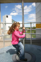 Sarah learns about momentum at the Great Lakes Science Center in Cleveland.