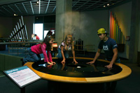 Teamwork: Derick, Becca and Sarah create cloud formations at the GReat Lakes Science Center in Cleveland.