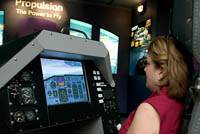 Carol tries out the flight simulator at the NASA Glenn Research Center.