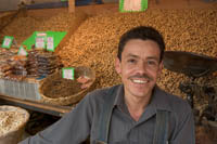 Vendor, Javier, sells peanuts and other nuts on the patio at Mercado Libertad, Guadalajara, Mexico.