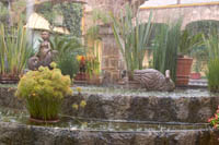 A sudden downpour splashes in the fountain at Quinta Real Hotel, Guadalajara, Jalisco, Mexico