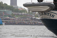 Spectators line the banks of the Elbe River to watch the opening procession of ships for the Hamburg Harbor birthday Celebration in the rain.