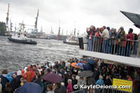 Crowds watch the Tugboat Ballet in the rain at the Hamburg Harbor Birthday.