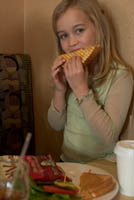 Jade enjoys a grilled cheese sandwich at the Disney Soda Fountain in Hollywood. Š Kayte Deioma