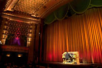 An organist plays the 1929 Wurlitzer pipe organ before a movie at El Capitan Theatre. Š Kayte Deioma