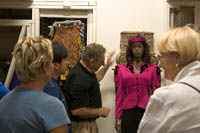 A tour group looks at Whoopi Goldberg's costume from "Ghost" at the Hollywood Entertainment Museum in Hollywood, CA. Š Kayte Deioma 