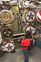 Lisa Raymond examines the torpedo tubes on the Russian Foxtrot Submarine "Scorpion" on display in Long Beach, CA.