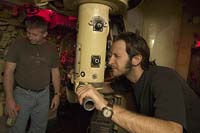 A visitor looks through the periscope of the Russian Foxtrot Submarine "Scorpion" at the Queen Mary in Long Beach, CA
