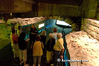 Visitors stand in the aqueduct that turned the Little St. Lawrence River into a sewer. Š Kayte Deioma
