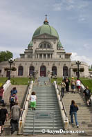 A pilgrim climbs the stairs of St. Joseph's Oratory on her knees. Montreal. Š Kayte Deioma
