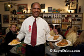 Native New Orleanian Harold Toussaint delivers award-winning fried chicken and roasted chicken at the Praline Connection Southern Creole Soulfood Restaurant on Frenchmen Street in New Orleans, LA