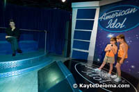 Sarah and Becca sing for a wax Simon on the American Idol set at Madame Tussauds