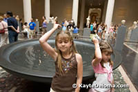 Becca and Sarah make wishes in the fountain in the Greek and Roman exhibit at the Met.