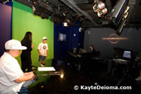 Volunteers get to read the news and weather on the NBC Studio Tour in New York.