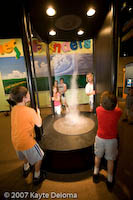 Kids generate a tornado at the Family Museum in Bettendorf.