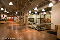 Giant guitar frets adorn the hardwood floor of the River Music Experience