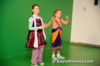 Two girls in funny costumes sing karaoke in the Music Production Lab upstairs at the Zeum.