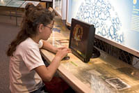 Nine-year-old Dusty replays a video clip of a nuclear test at the Bradbury Science Museum, Los Alamos, NM. 