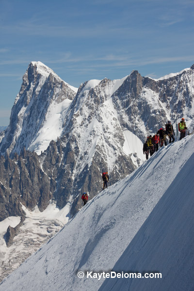 Mountain climbers near Mont Blanc, France seen from Aiguille du Midi