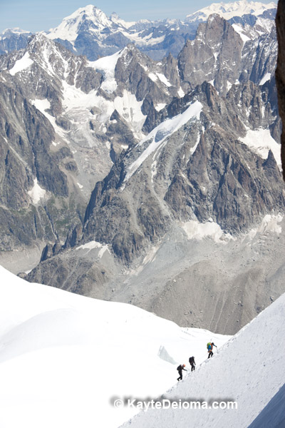 Mountain climbers near Mont Blanc, France seen from Aiguille du Midi